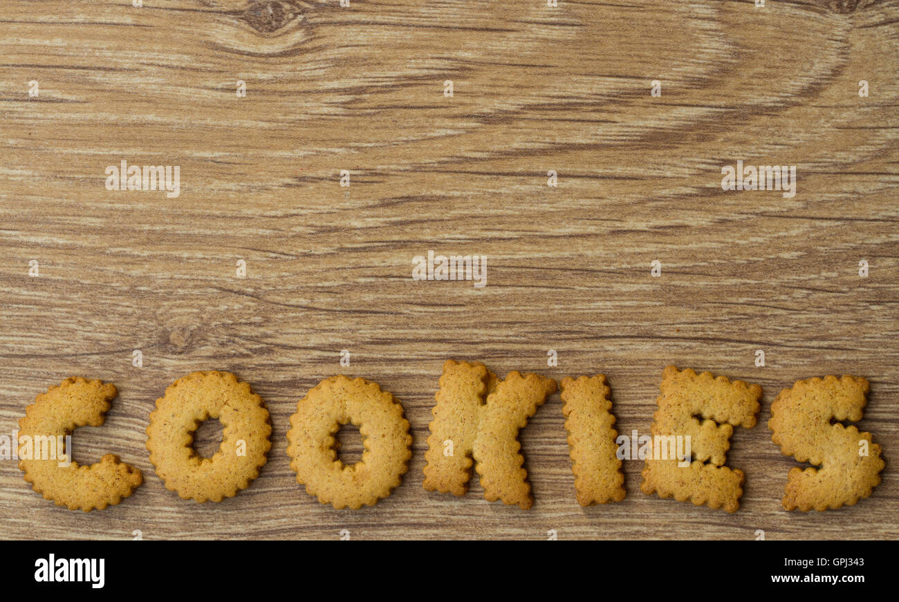 The word cookies spelled from alphabet shaped biscuits for a food background, Stock Photo