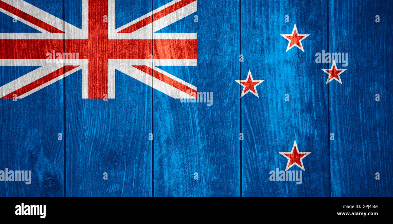 flag of New Zealand or New Zealander banner on wooden background Stock Photo