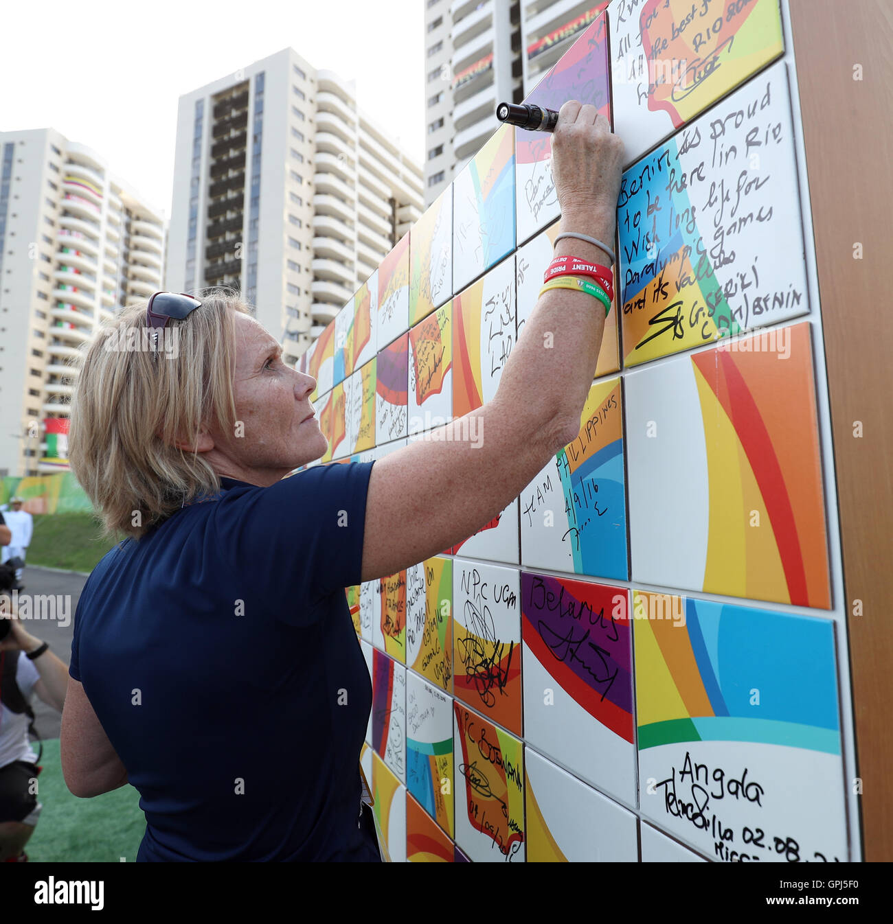 ParalympicsGB Chef de Mission Penny Briscoe writes a message on a wall during the Paralympics GB Welcome Ceremony at the Athletes Village ahead of the 2016 Rio Paralympic Games, Brazil. Stock Photo