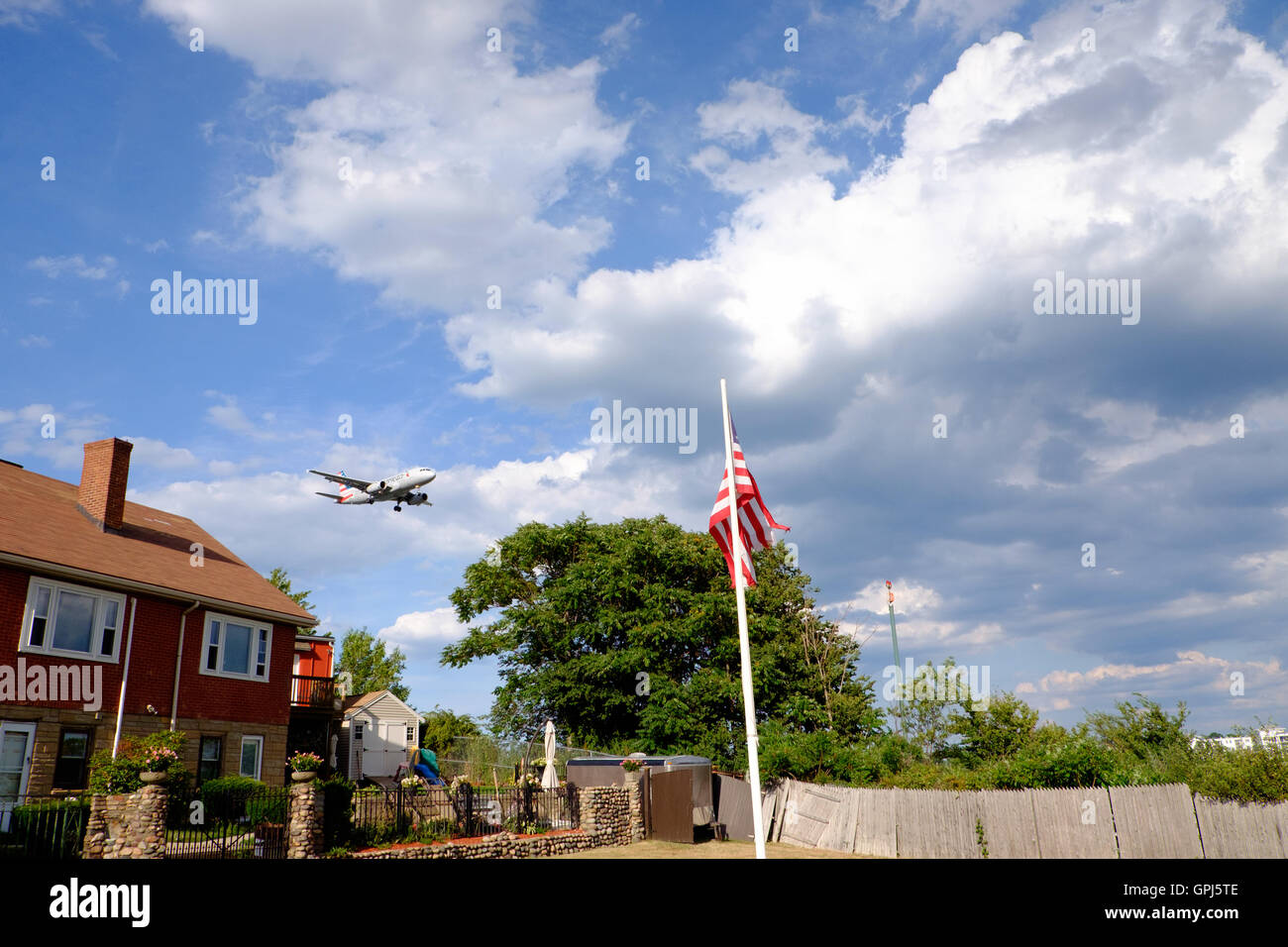 American Airlines jet flying over Orient Heights and about to land at