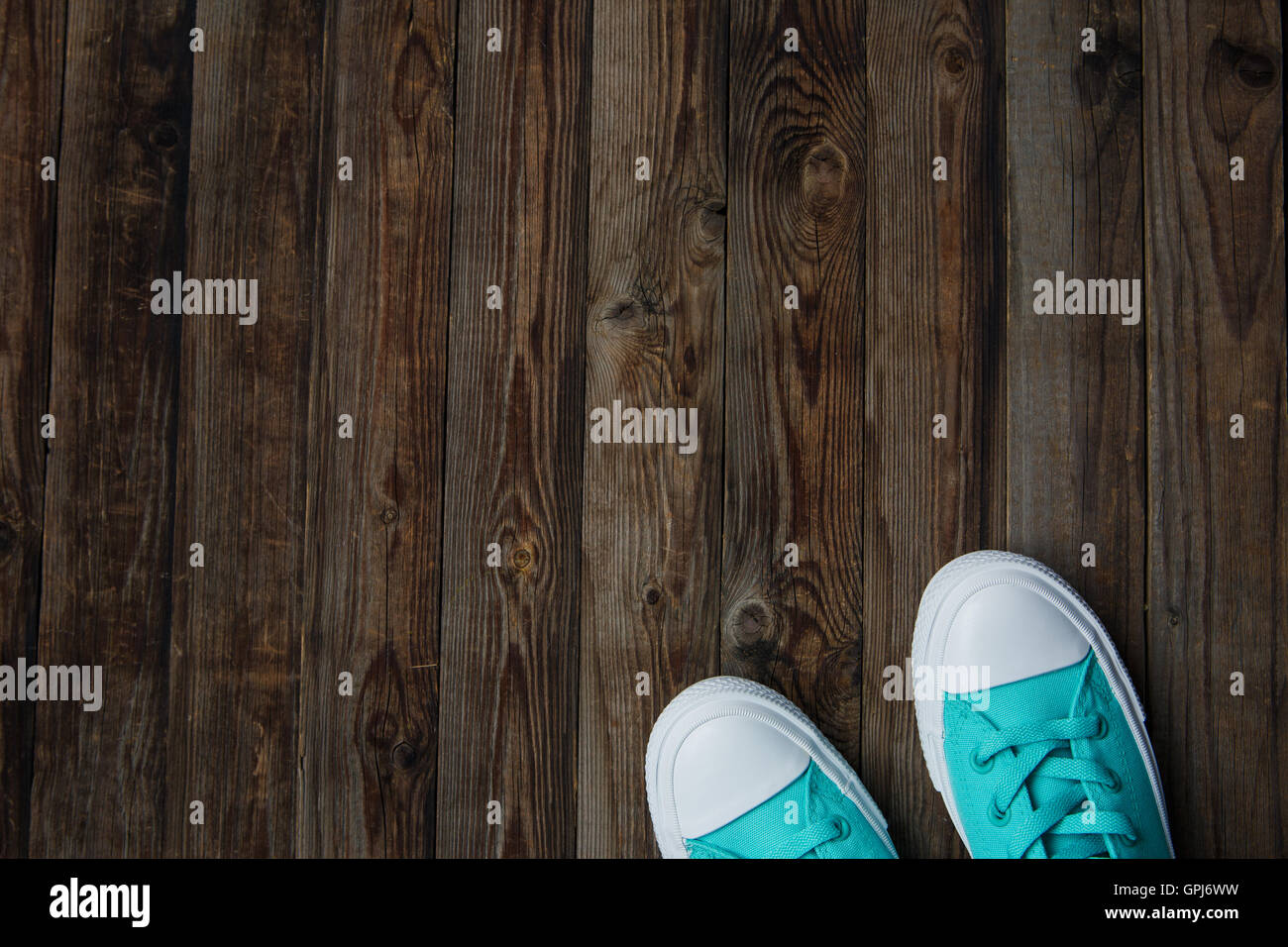 socks of sneakers on wooden floor Stock Photo - Alamy