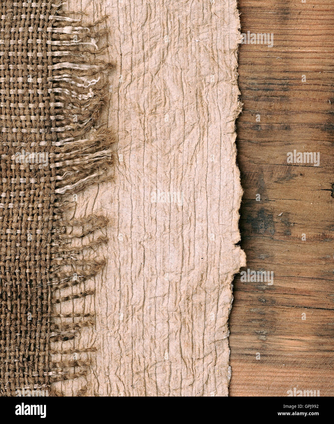 Old paper with natural burlap on wooden backround Stock Photo