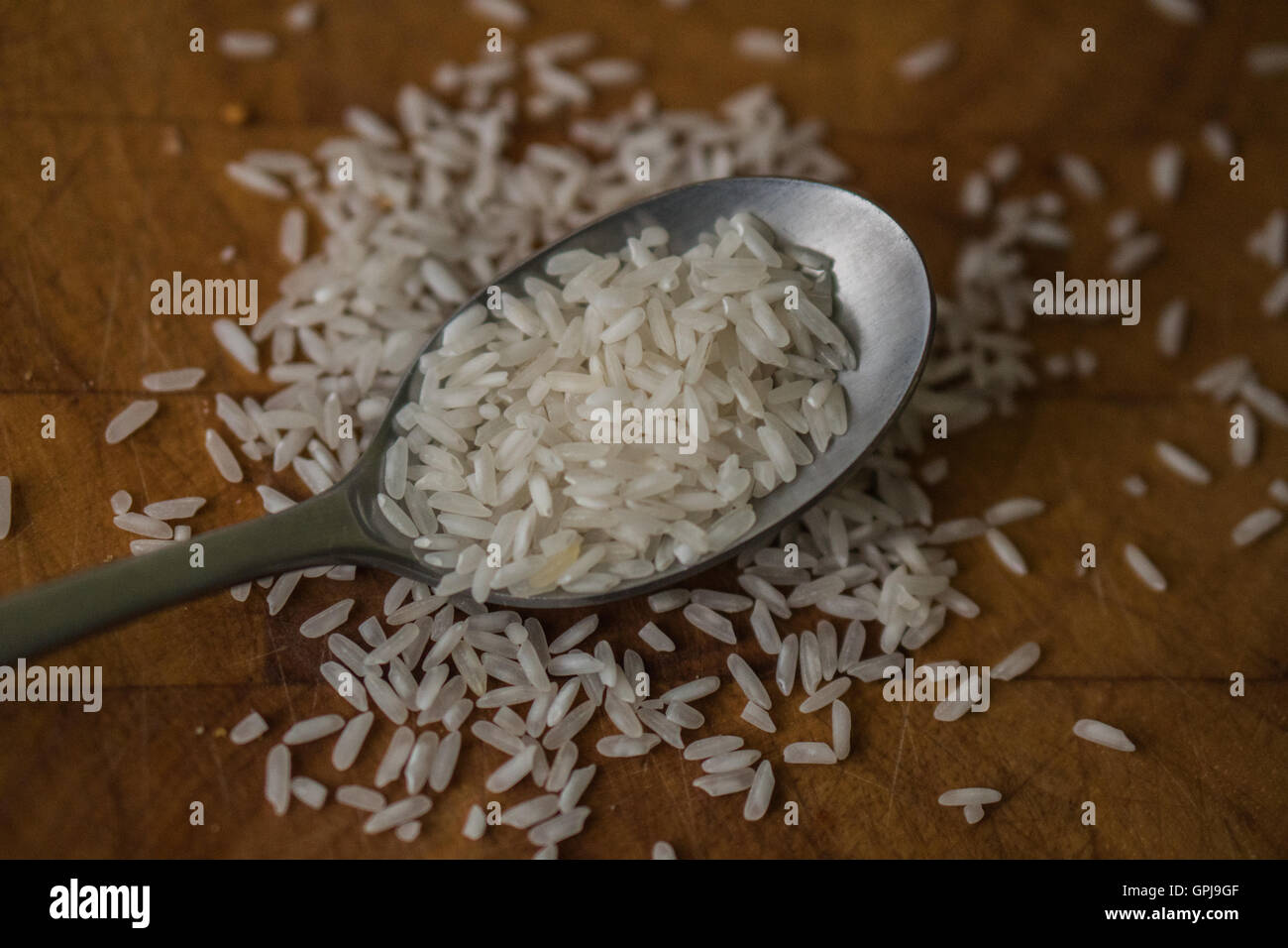 spoons of rice Stock Photo Alamy