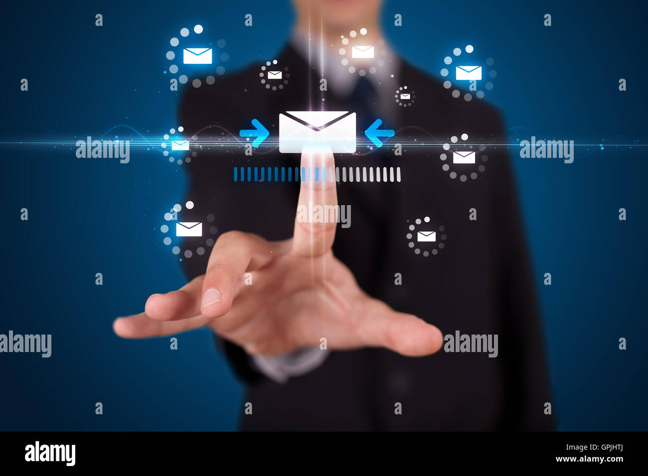 Businessman pressing virtual messaging type of icons Stock Photo - Alamy