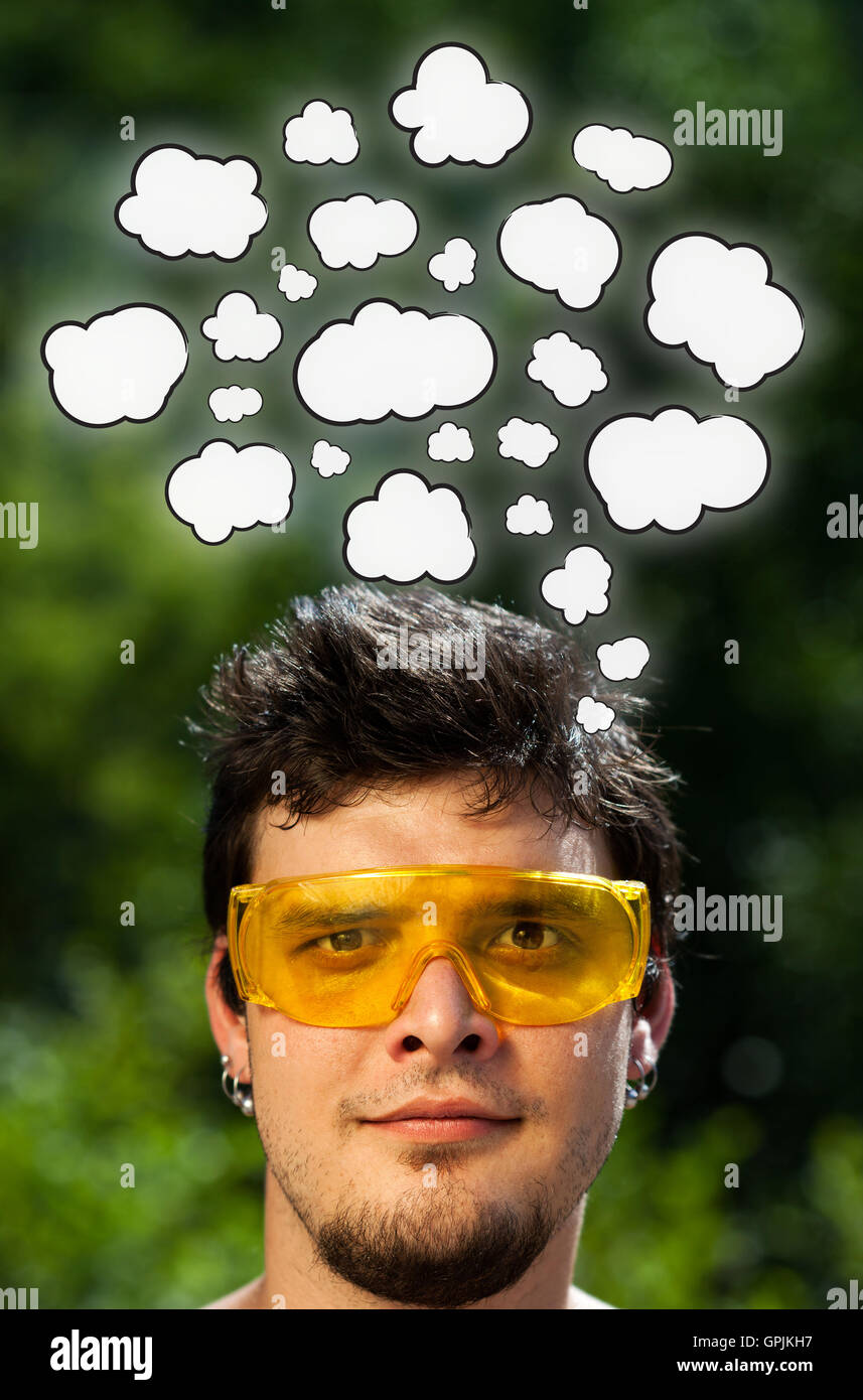 Young head thinking with clouds Stock Photo - Alamy