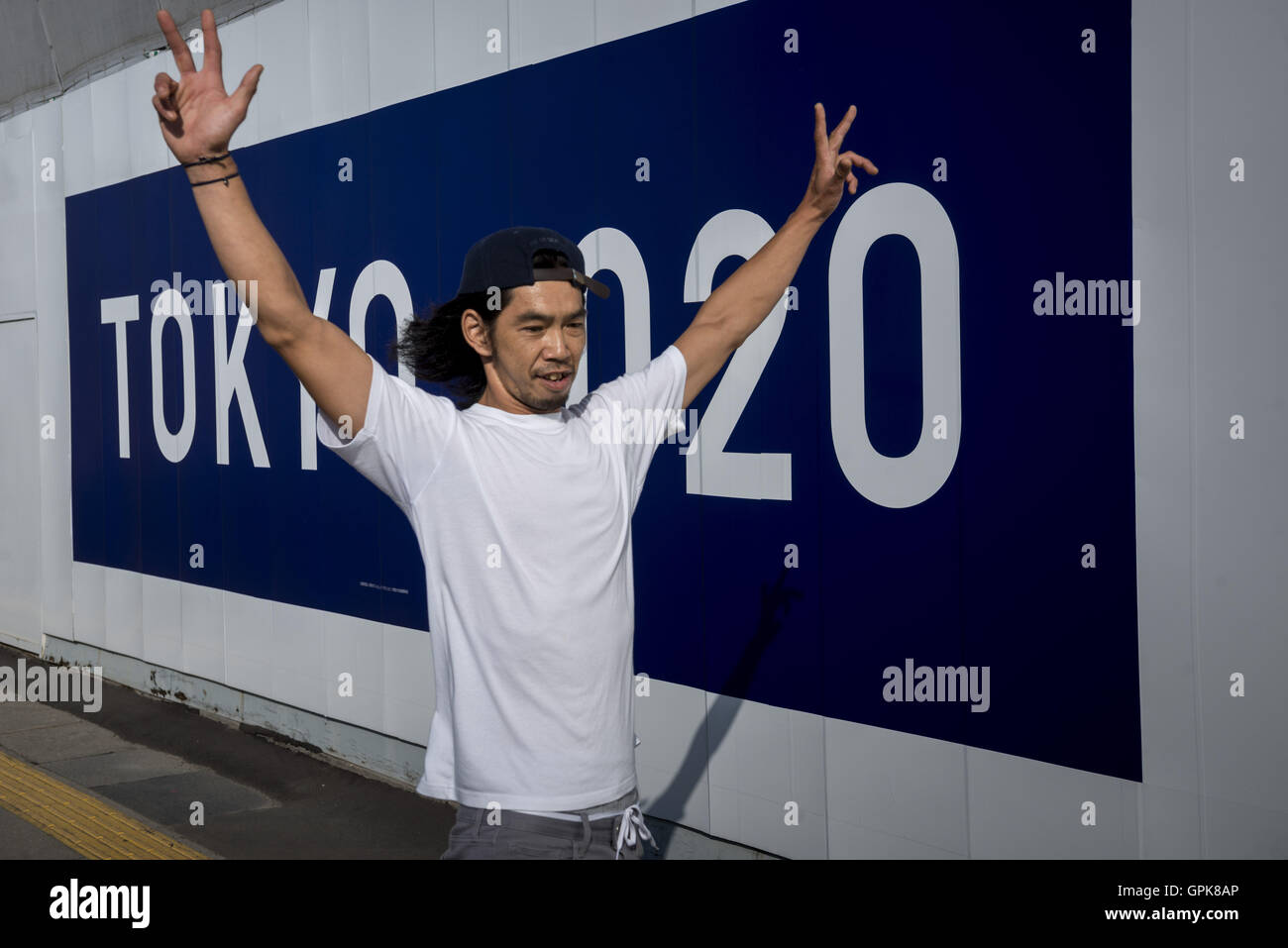 Tokyo, Tokyo, Japan. 4th Sep, 2016. Pedestrians pass the official emblem banner of Tokyo Olympics 2020 in center of Tokyo City. © Alessandro Di Ciommo/ZUMA Wire/Alamy Live News Stock Photo