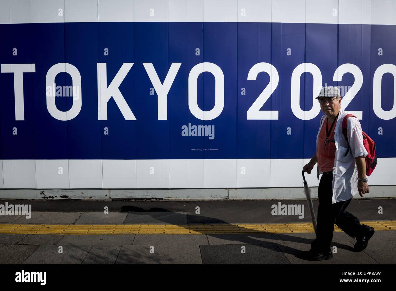 Tokyo, Tokyo, Japan. 4th Sep, 2016. Pedestrians pass the official emblem banner of Tokyo Olympics 2020 in center of Tokyo City. © Alessandro Di Ciommo/ZUMA Wire/Alamy Live News Stock Photo
