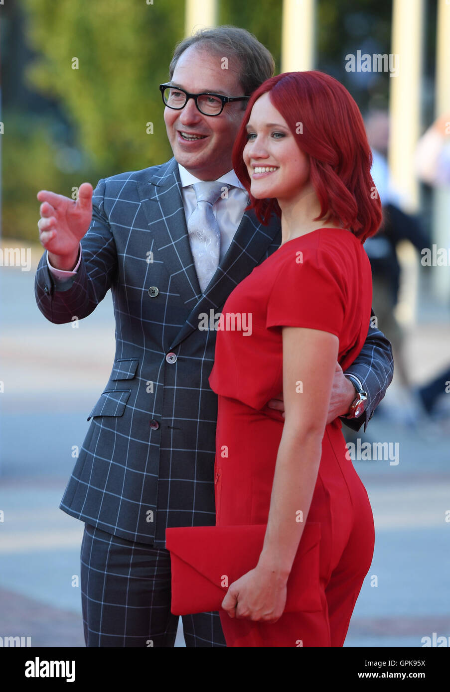 Berlin, Germany. 1st Sep, 2016. German Minister of Traffic Alexander Dobrindt (CSU) and Miss IFA posing during the opening gala of the Internationale Funk-Ausstellung IFA electronics fair in Berlin, Germany, 1 September 2016. The IFA is known as the world's biggest fair for entertainment technology, IT and household appliances and takes place between 2 and 7 September 2016. PHOTO: SOEREN STACHE/dpa/Alamy Live News Stock Photo