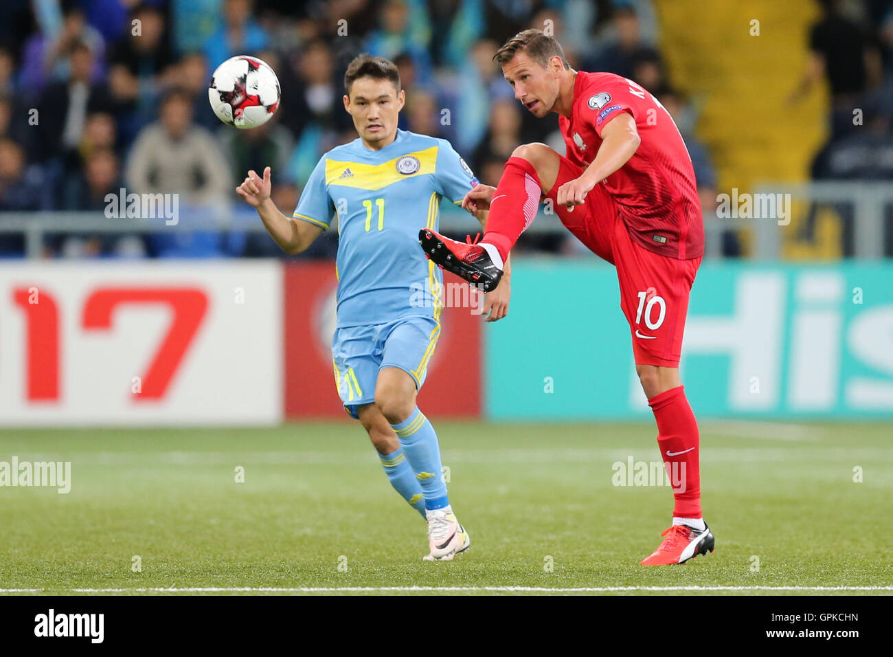 Astana, Kazakhstan. 4th September, 2016. Grzegorz Krychowiak (POL), Serikzhan Muzhikov (KAZ), Kazakhstan versus Poland, FIFA World Cup 2018 qualifier. The game ended in a 2-2 draw Credit: Action Plus Sports Images/Alamy Live News Stock Photo