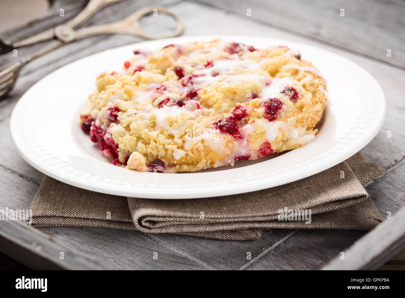 Crumble cake with red currants and frosting. Stock Photo