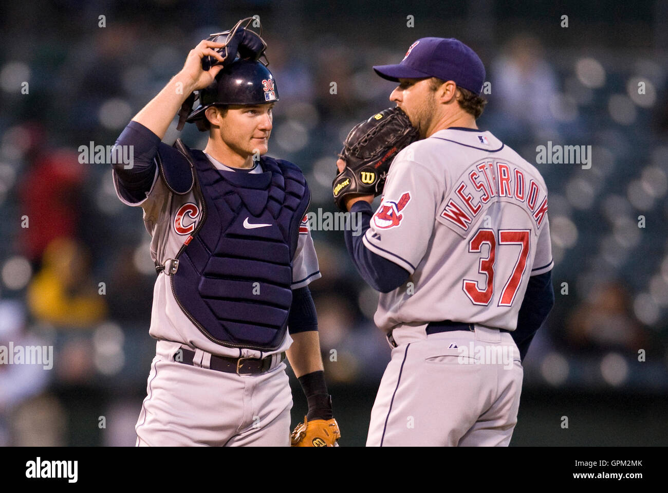 April 23, 2010; Oakland, CA, USA;  Cleveland Indians starting pitcher Jake Westbrook (37) talks with catcher Lou Marson (30) during the third inning against the Oakland Athletics at Oakland-Alameda County Coliseum. Oakland defeated Cleveland 10-0. Stock Photo
