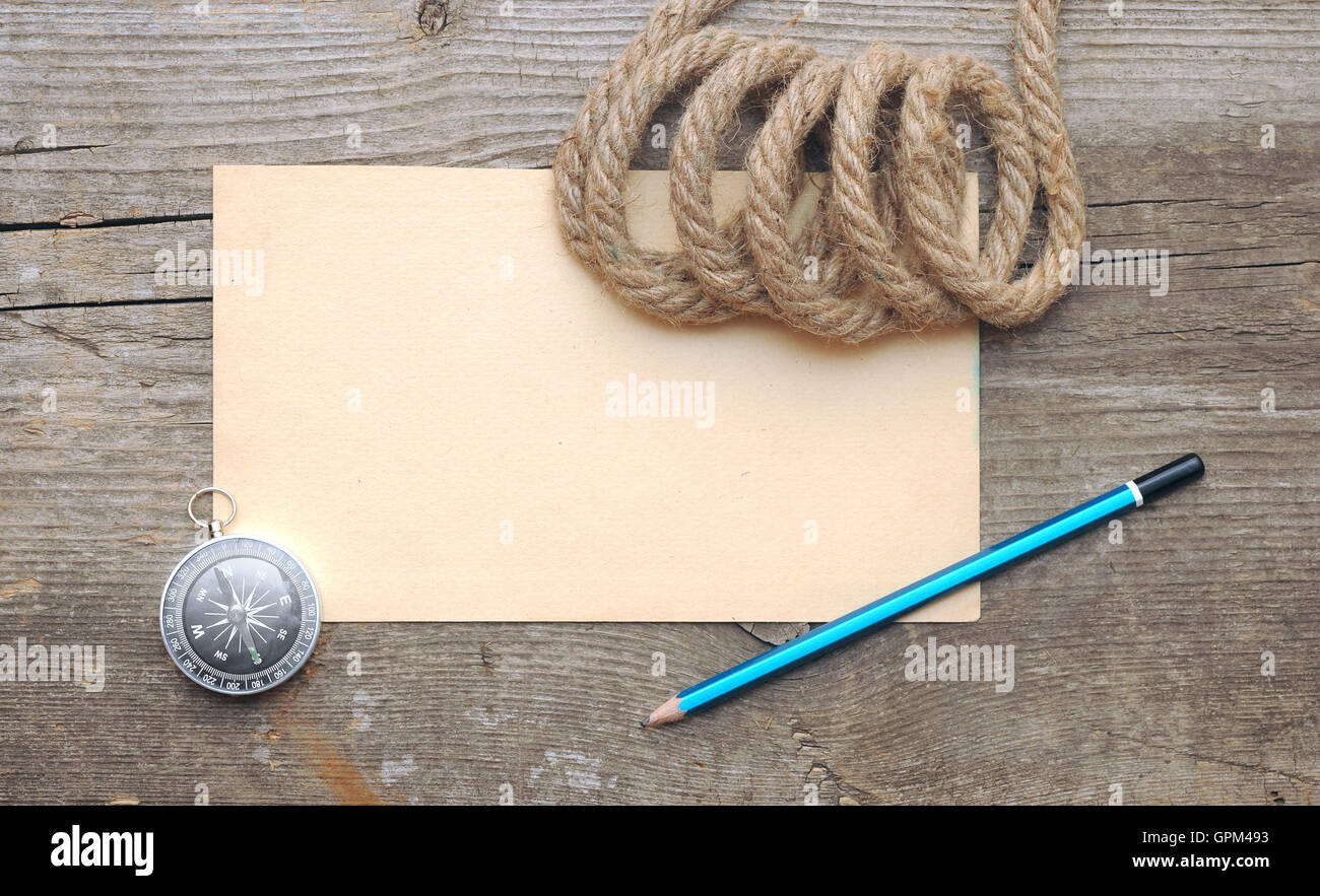 Compass and rope on the old paper background Stock Photo - Alamy