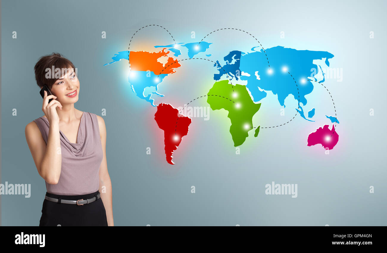 young woman making phone call with colorful world map Stock Photo