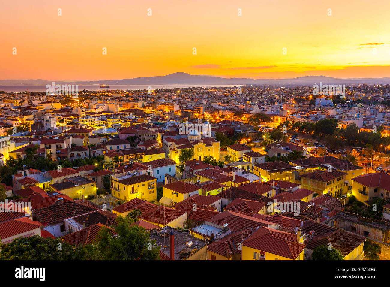 Kalamata city skyline in the evening after sunset with city lights in the foreground Stock Photo