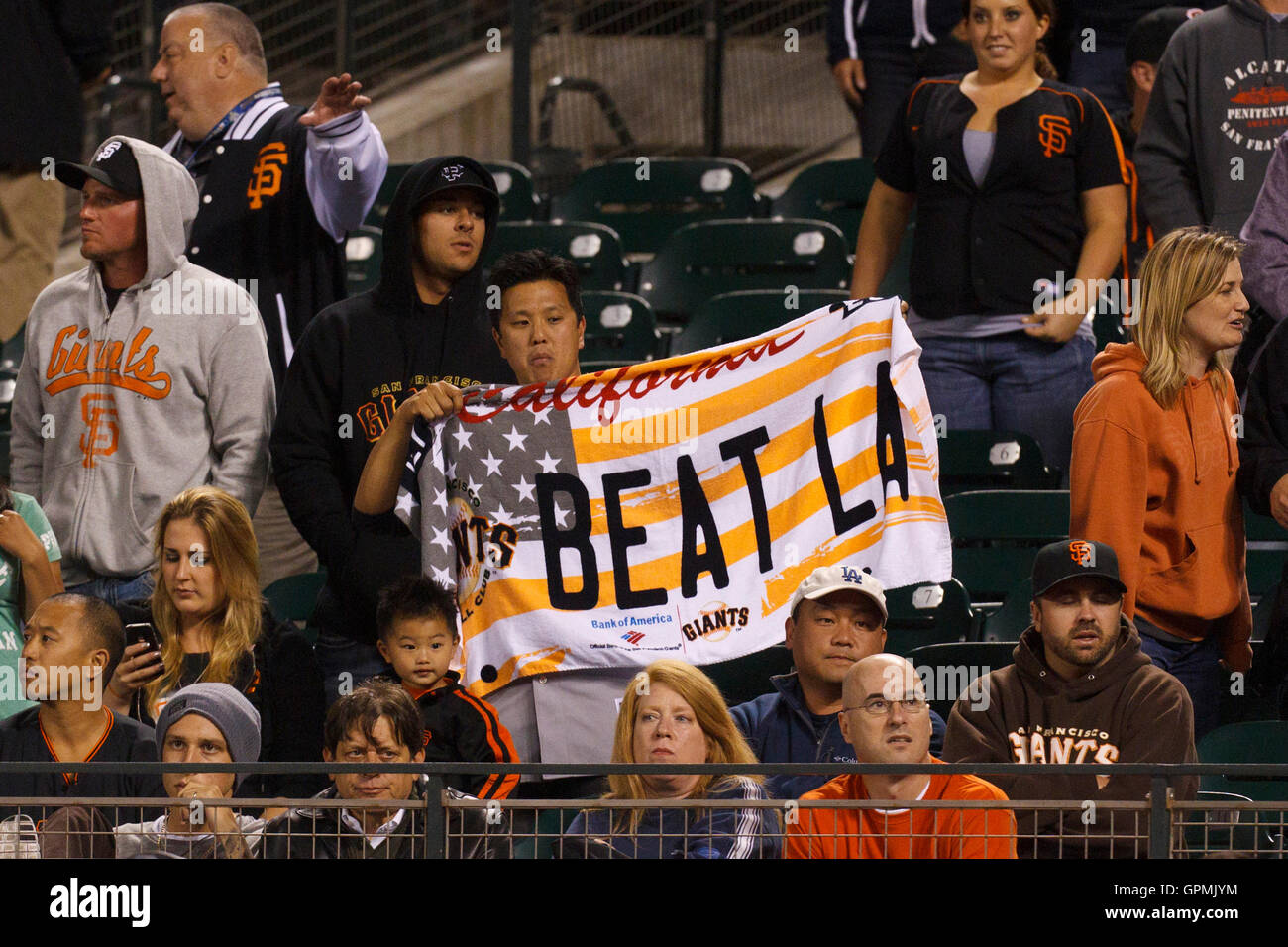 July 18, 2011; San Francisco, CA, USA; A San Francisco Giants fan holds up  a sign that reads beat LA during the ninth inning against the Los Angeles  Dodgers at AT&T Park.