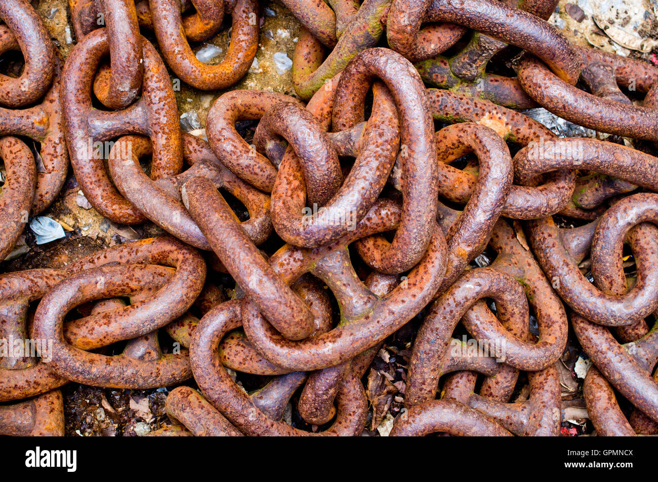 old rusty iron chains, knotted and worn from use Stock Photo - Alamy