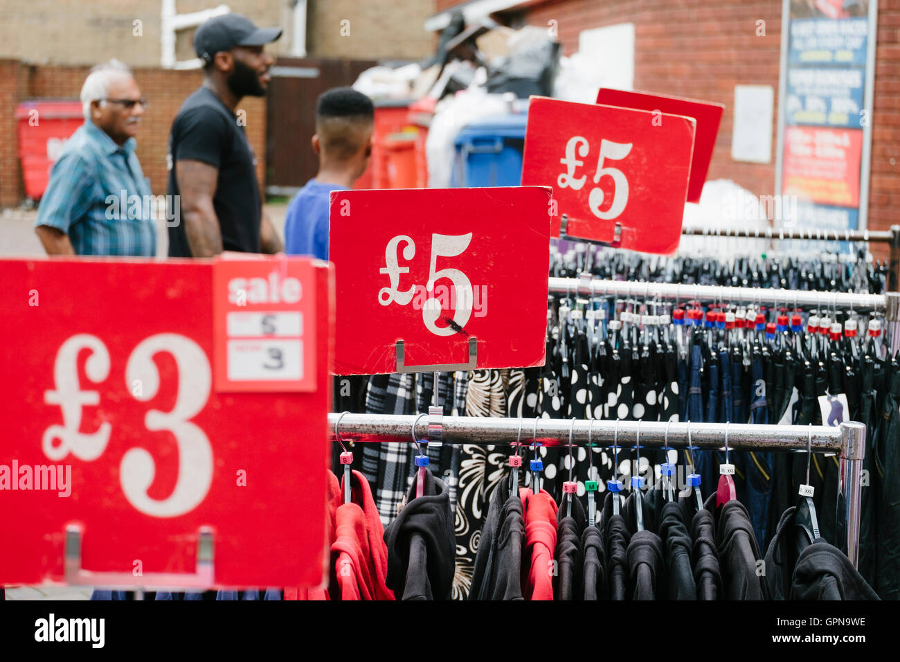 Market clothing racks with price tags Stock Photo