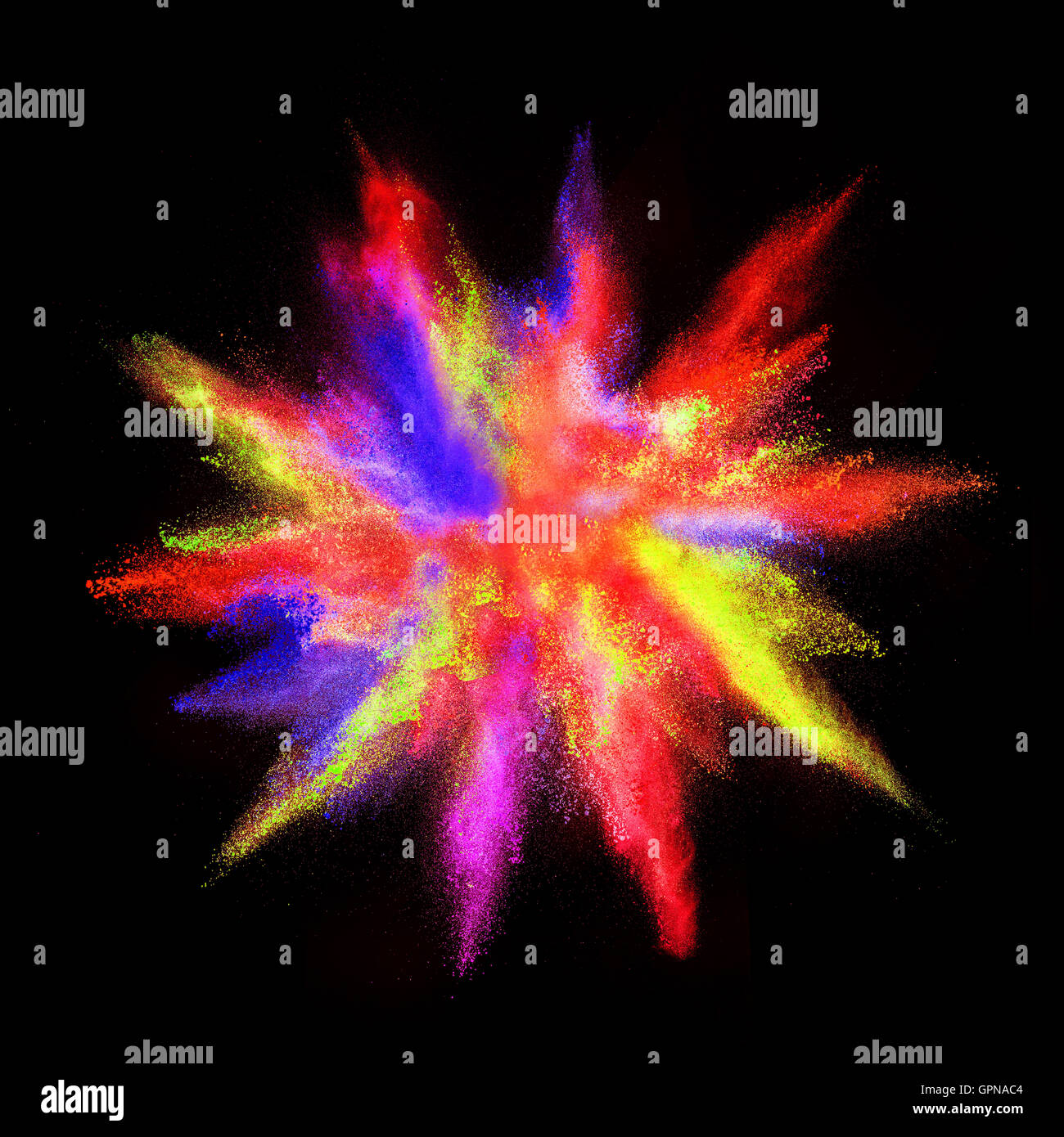 Explosions of colored powder, isolated on black background Stock Photo
