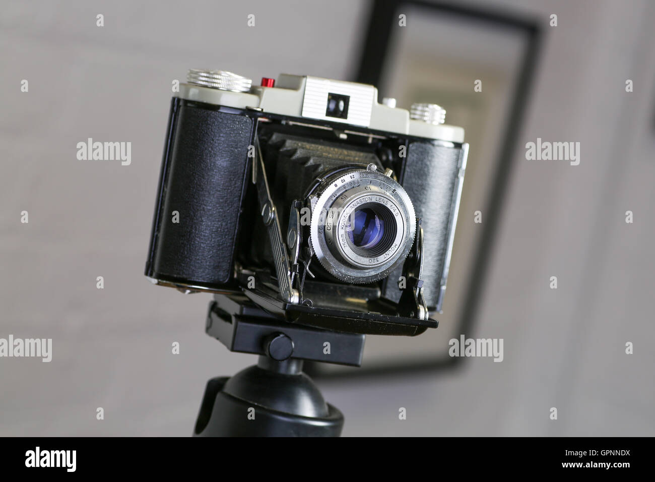 A Kodak 6x6 folding camera taking 120 roll film.The folding mechanism