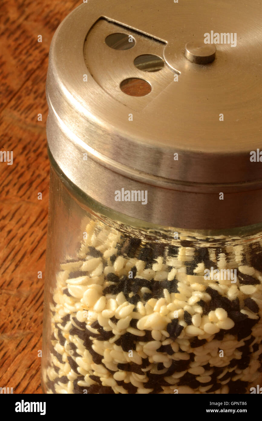White sesame seeds and black cumin seeds in a shaker Stock Photo Alamy