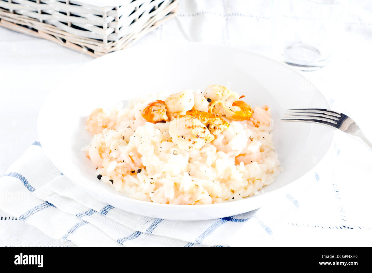 Delicious risotto with shrimp and scallops hi-res stock photography and