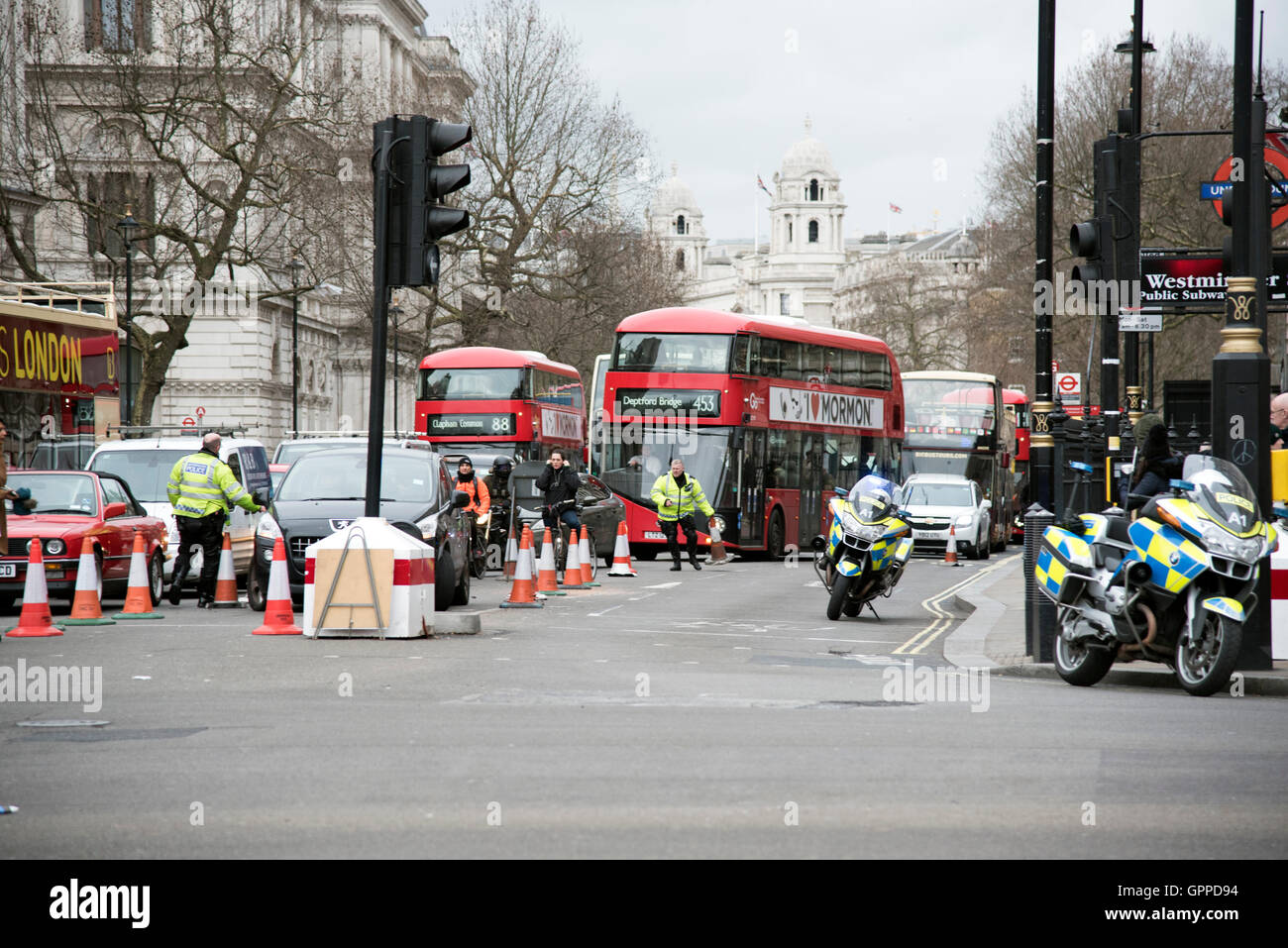 Police motorcyclists coning off Whitehall traffic diversion Stock Photo