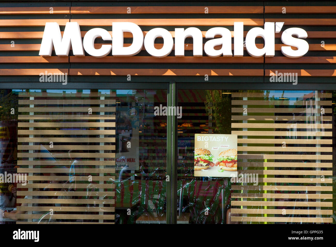 McDonald's sign, McDonald's is the world's largest chain of hamburger fast food restaurants, serving around 68 million customers Stock Photo