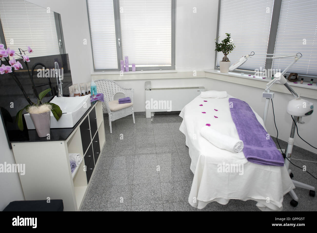 Massage table and equipment in modern beauty salon. Stock Photo
