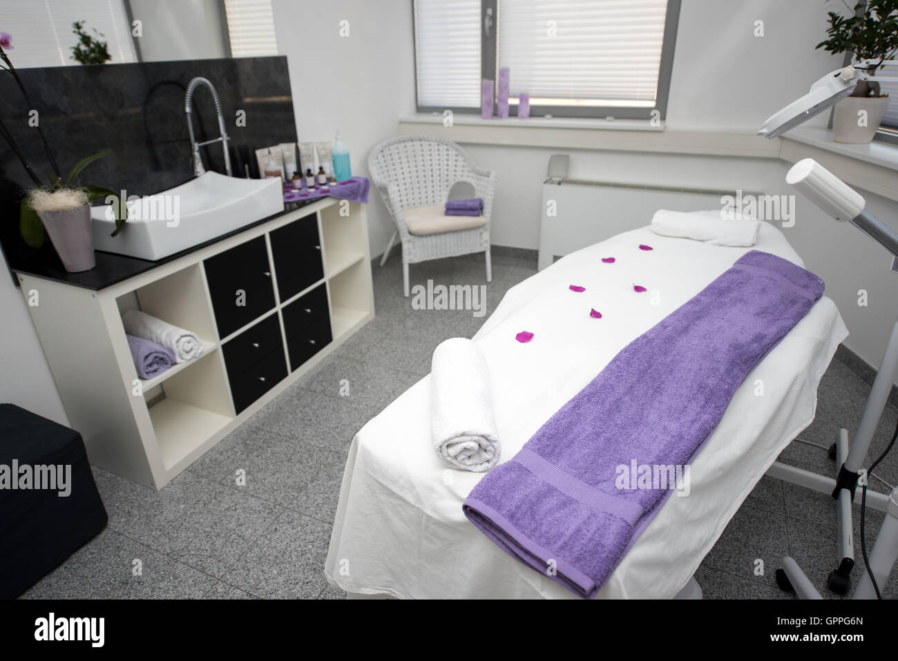 Massage table and equipment in modern beauty salon. Stock Photo