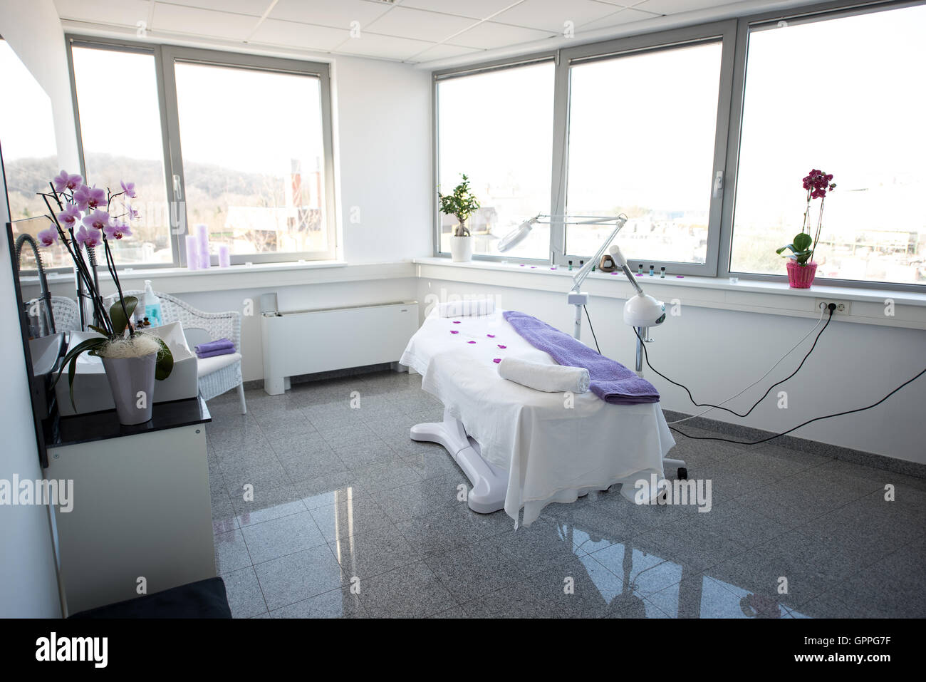 Massage table and equipment in modern beauty salon. Stock Photo