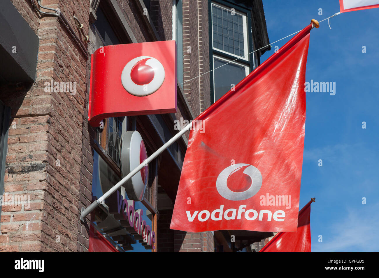 Vodafone logo. Vodafone Group is a British telecommunications company headquartered in London and with its registered office in Stock Photo