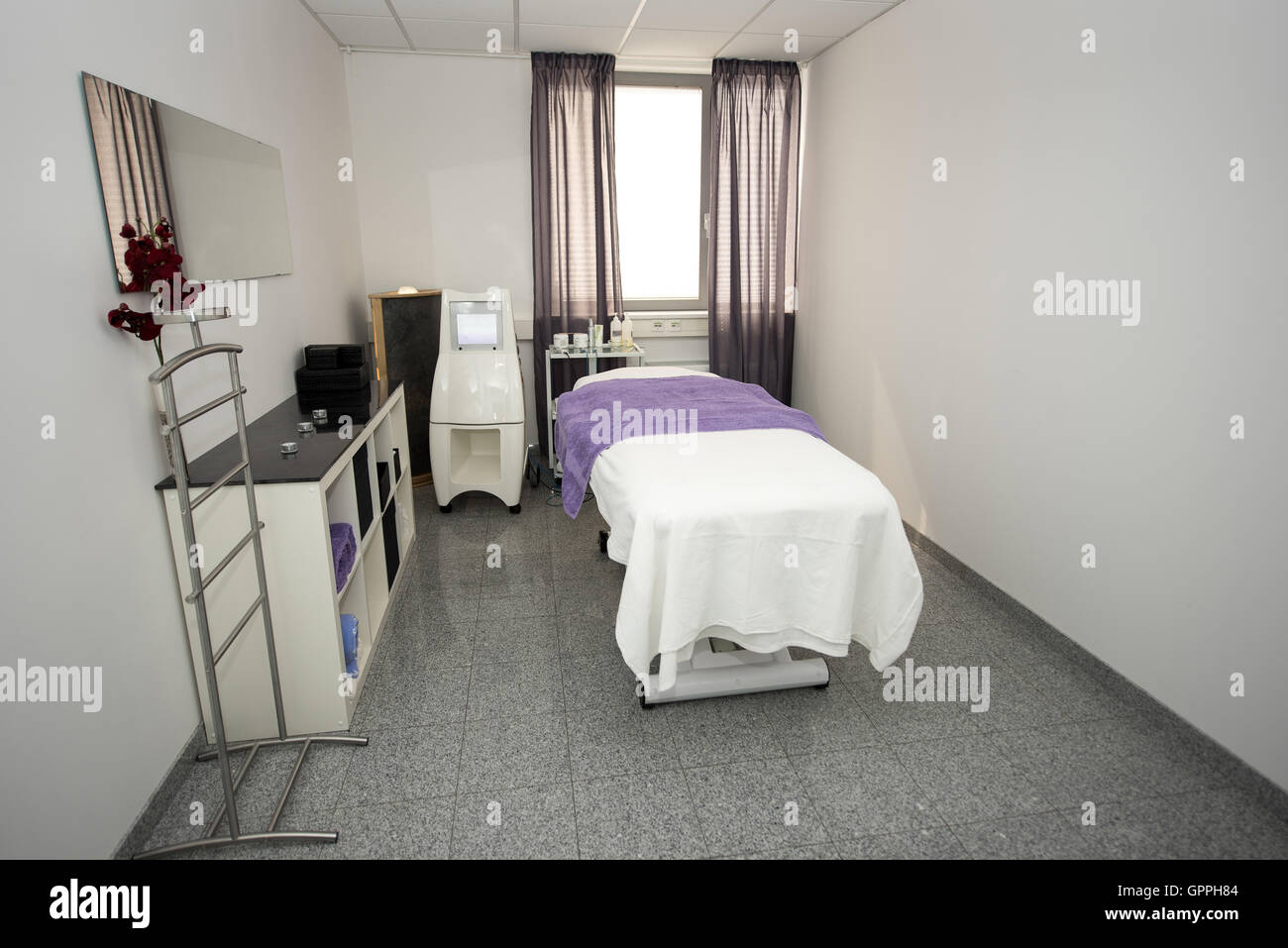Massage table and equipment in modern beauty salon. Stock Photo