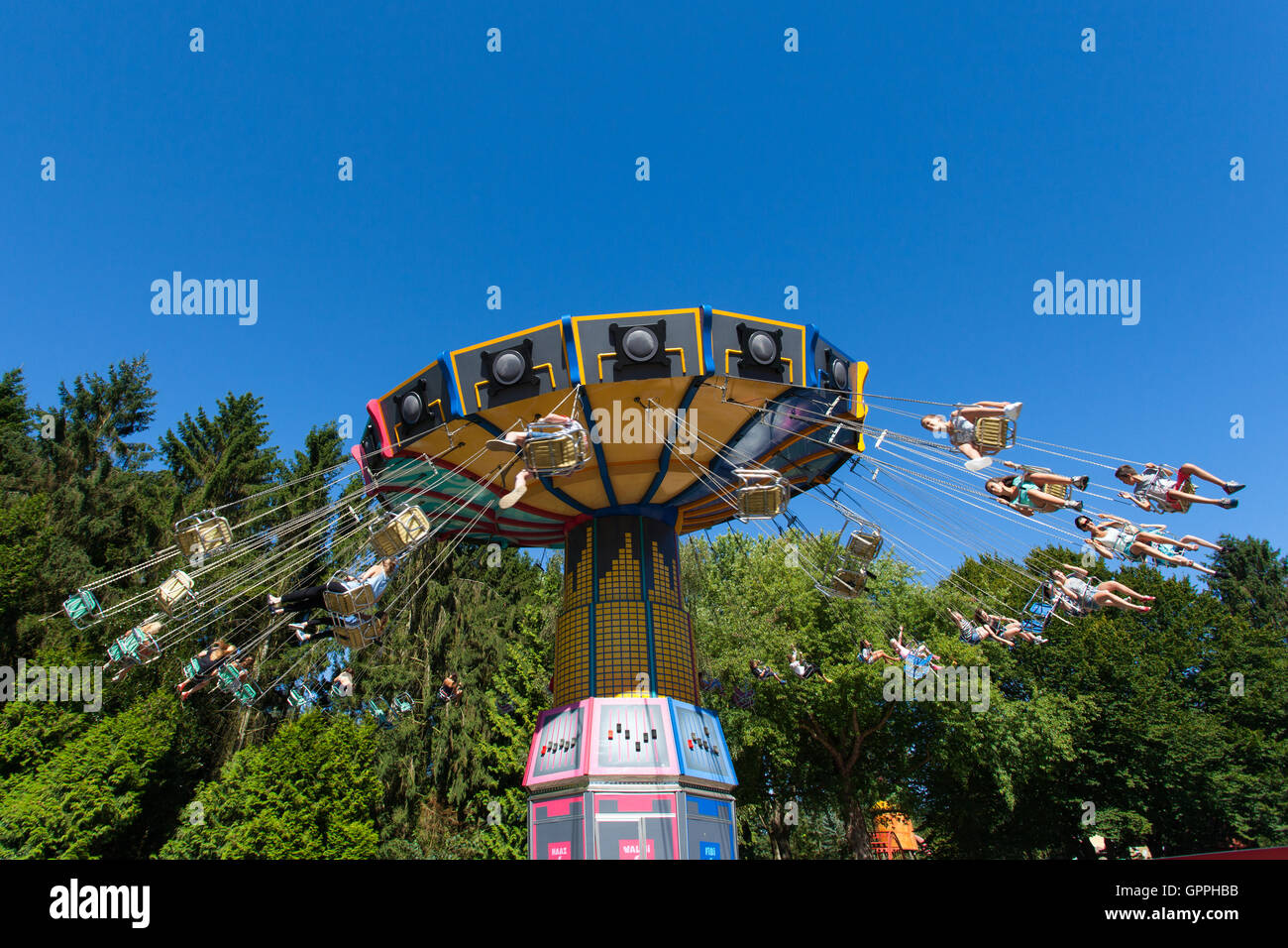 High speed carousel with park visitors during a ride at Walibi theme park. Stock Photo