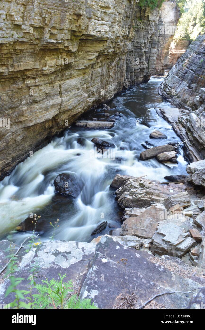 A long exposure of a river flowing through a chasm. Stock Photo