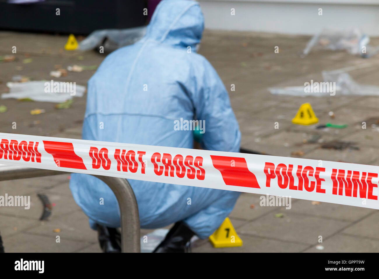 Police do not cross tape barrier & scene of crime officer / crimes