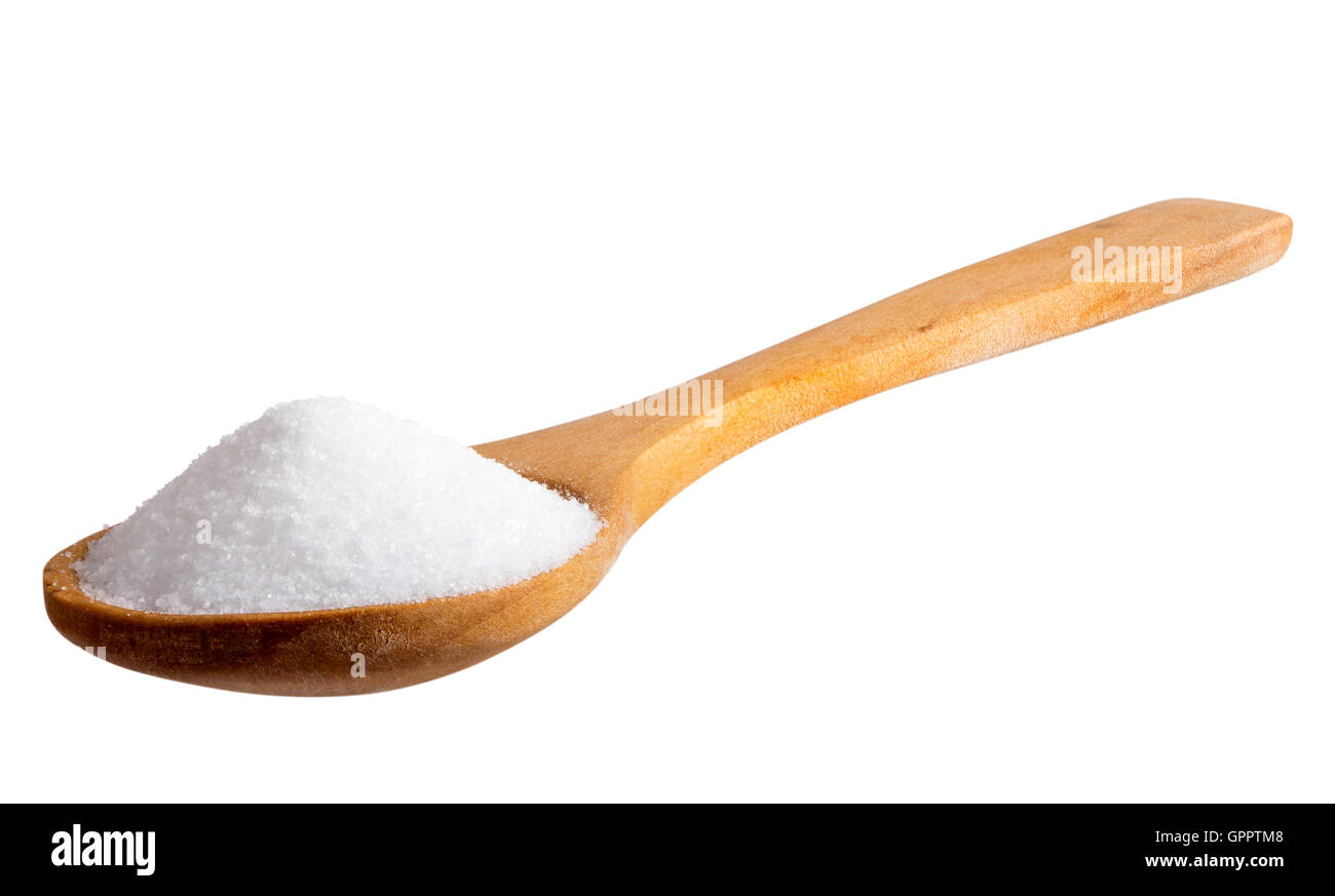 Salt in wooden spoon on white background. The image is a cut out, isolated on a white background, with a clipping path. Stock Photo