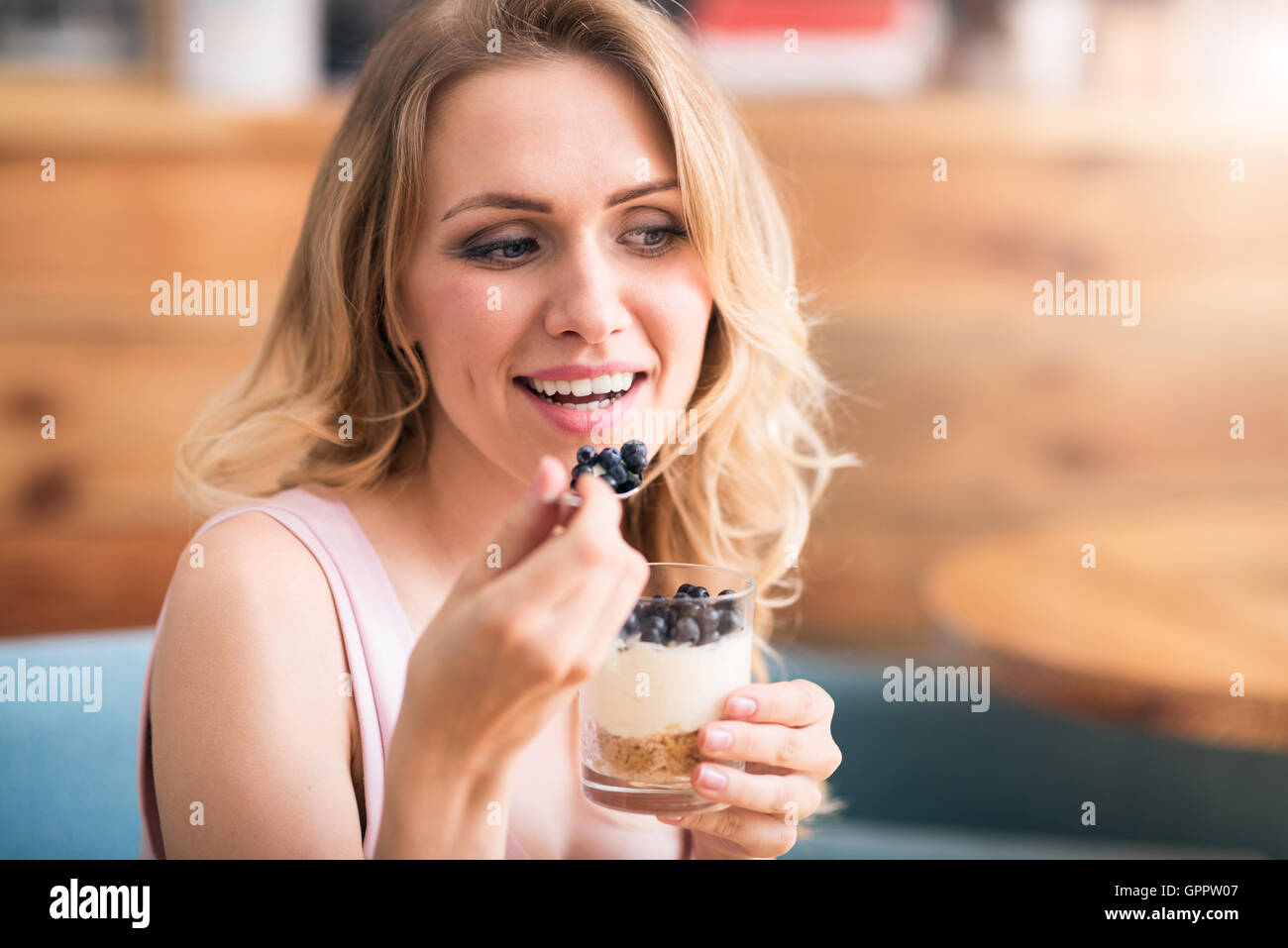 Nice young woman eating desert Stock Photo