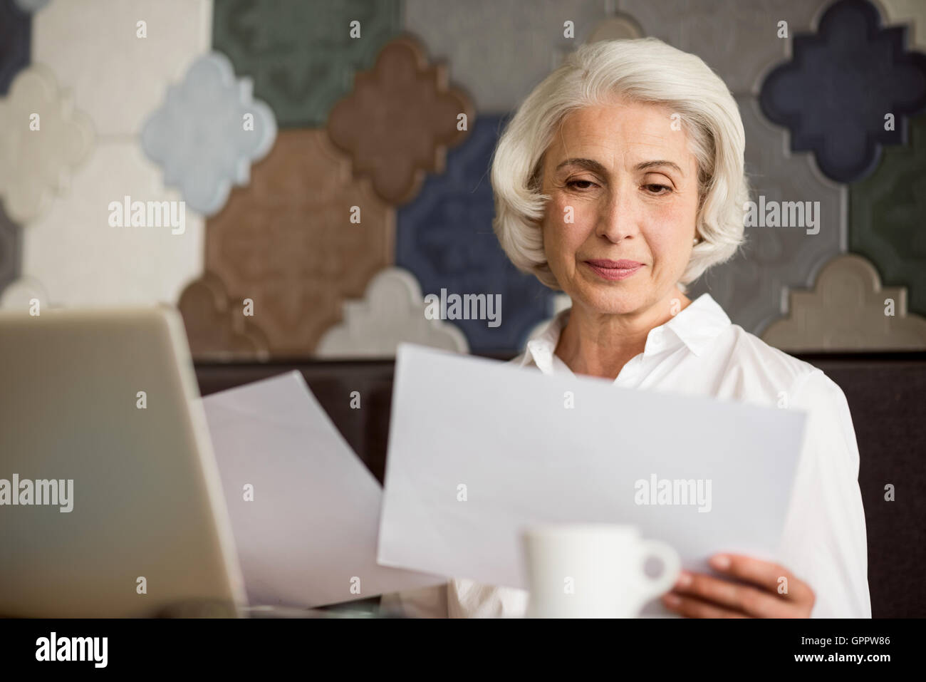 Joyful woman talking on cell phone Stock Photo - Alamy