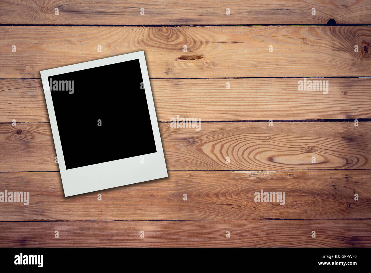 Blank photo frame on wood background and texture Stock Photo