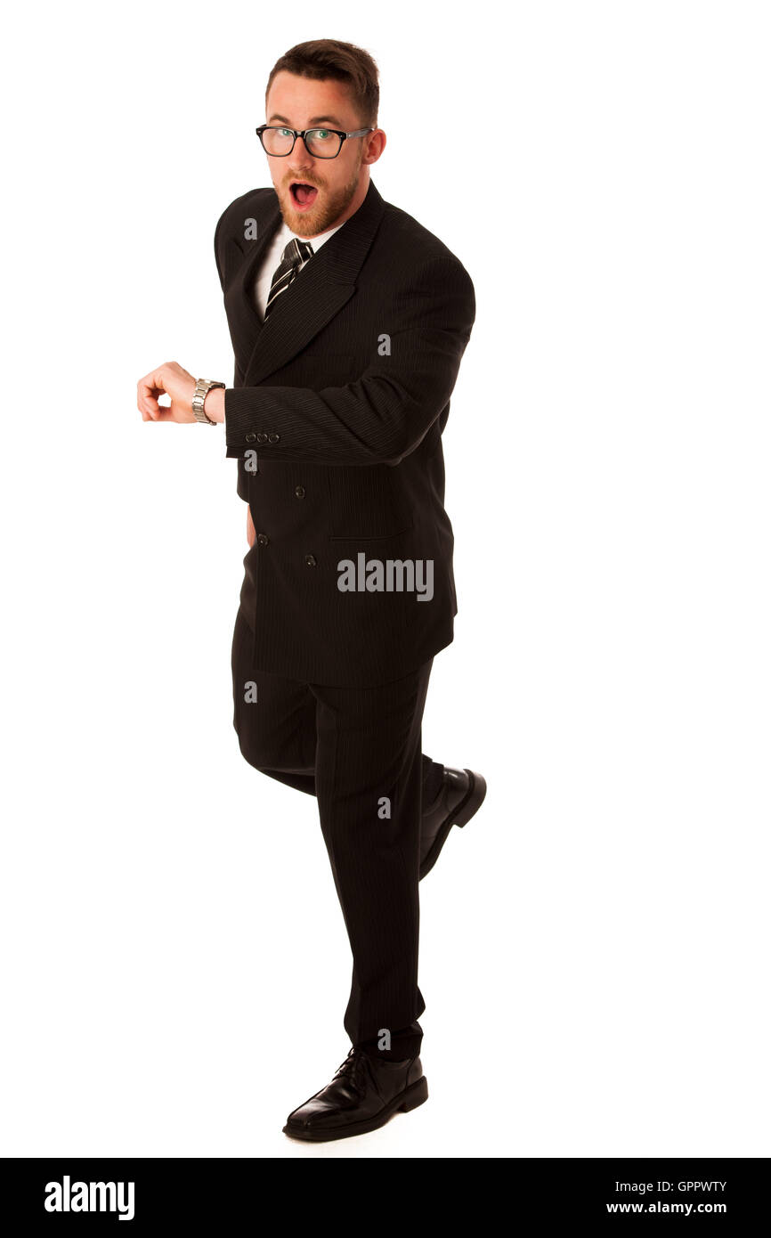 Successful businessman in formal suit checking time on wrist watch isolated over white. Stock Photo