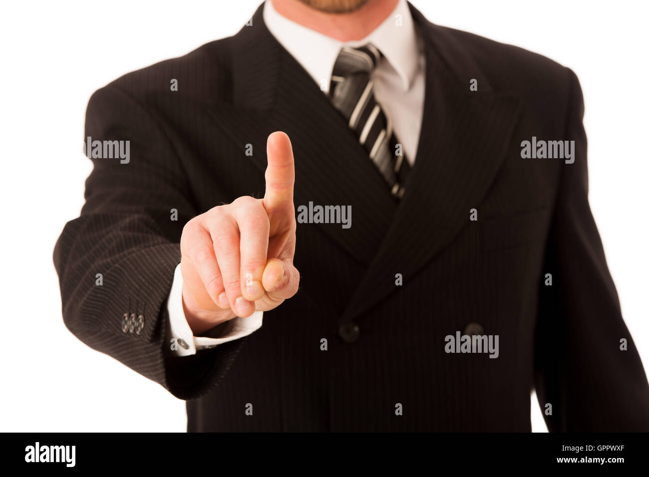 Happy young businessman in suit and tie presenting, promoting, advertising isolated over white. Stock Photo