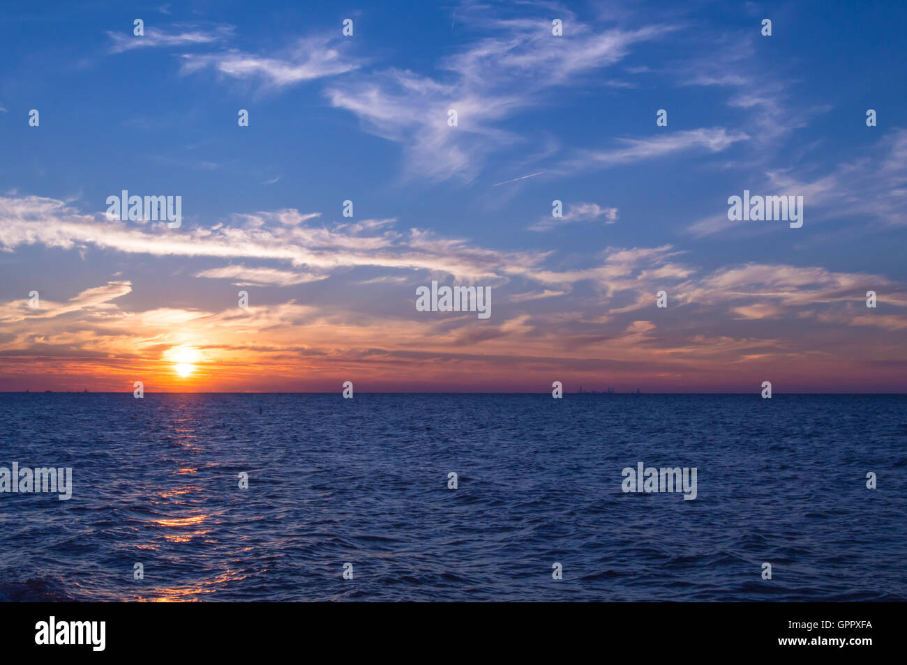 Sunset over Lake Michigan. Chicago Skyline can be seen on the horizon. Shot  at Indiana Dunes National Lakeshore Stock Photo - Alamy