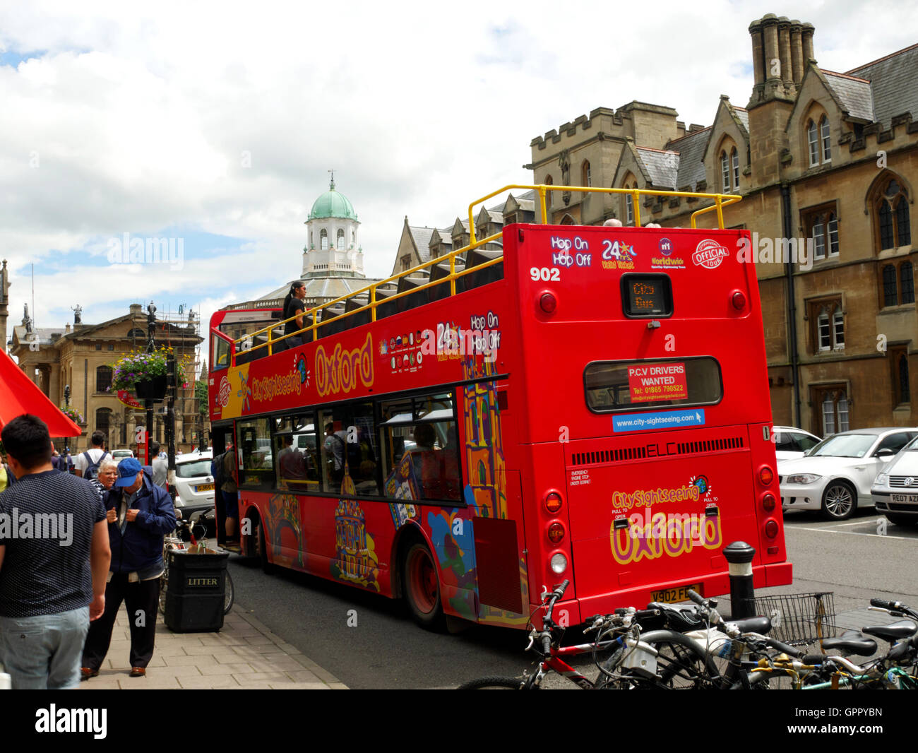 A red double-decker tour bus in Broad Street, Oxford. Stock Photo