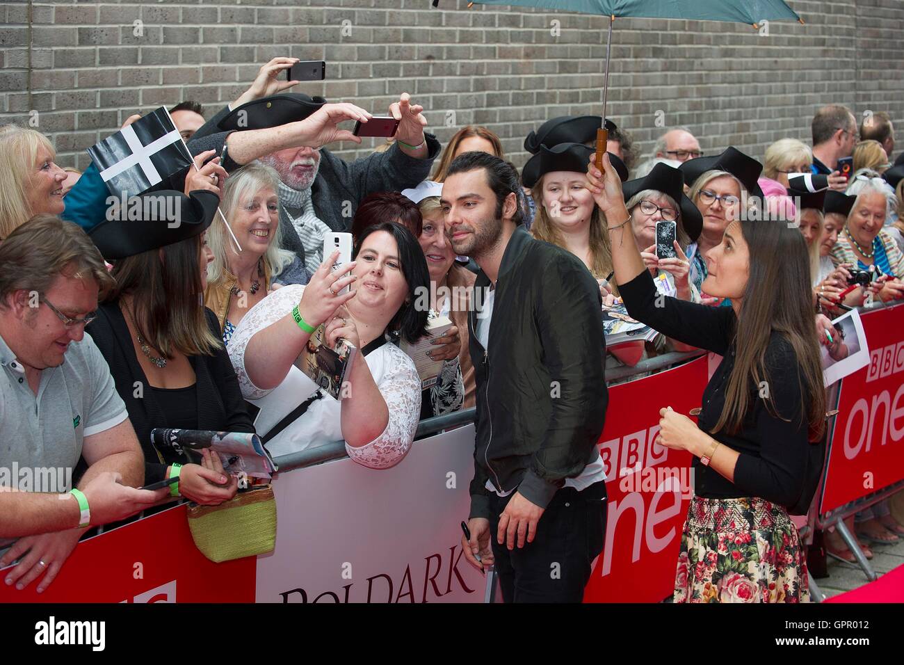 Aidan Turner meeting fans as he arrives at the premiere screening of series  two of BBC One's Poldark at White River Cinema in St Austell Stock Photo -  Alamy