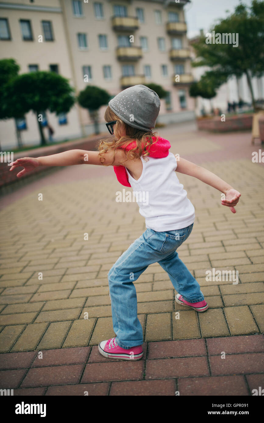 little girl dancing on the street Stock Photo Alamy