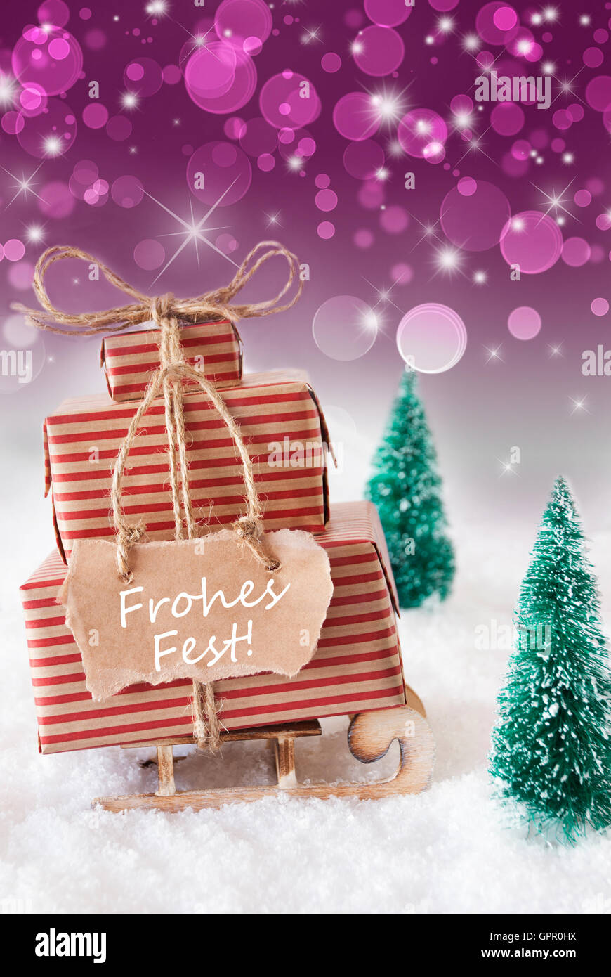 Vertical Sleigh On Purple Background, Frohes Fest Means Merry Christmas Stock Photo