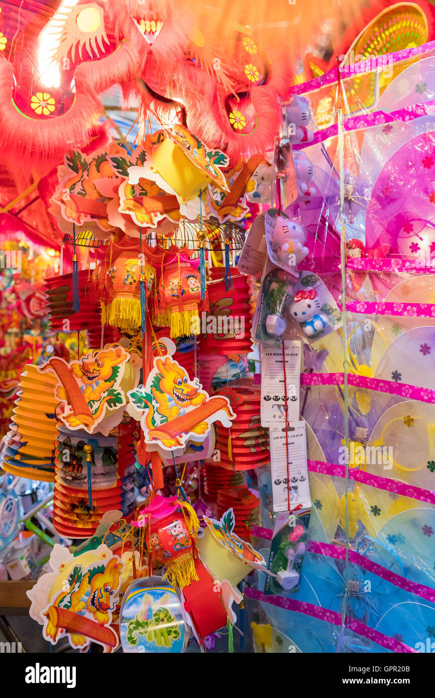 Lanterns and toys hanging on a stand in the streets of Cholon in Ho Chi ...
