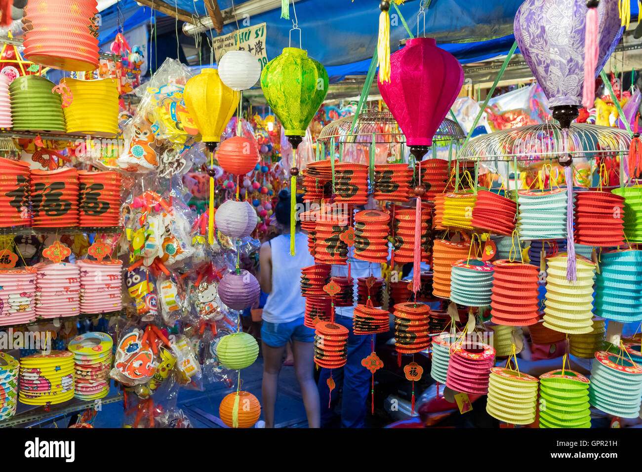 Lanterns and toys hanging on a stand in the streets of Cholon in Ho Chi ...