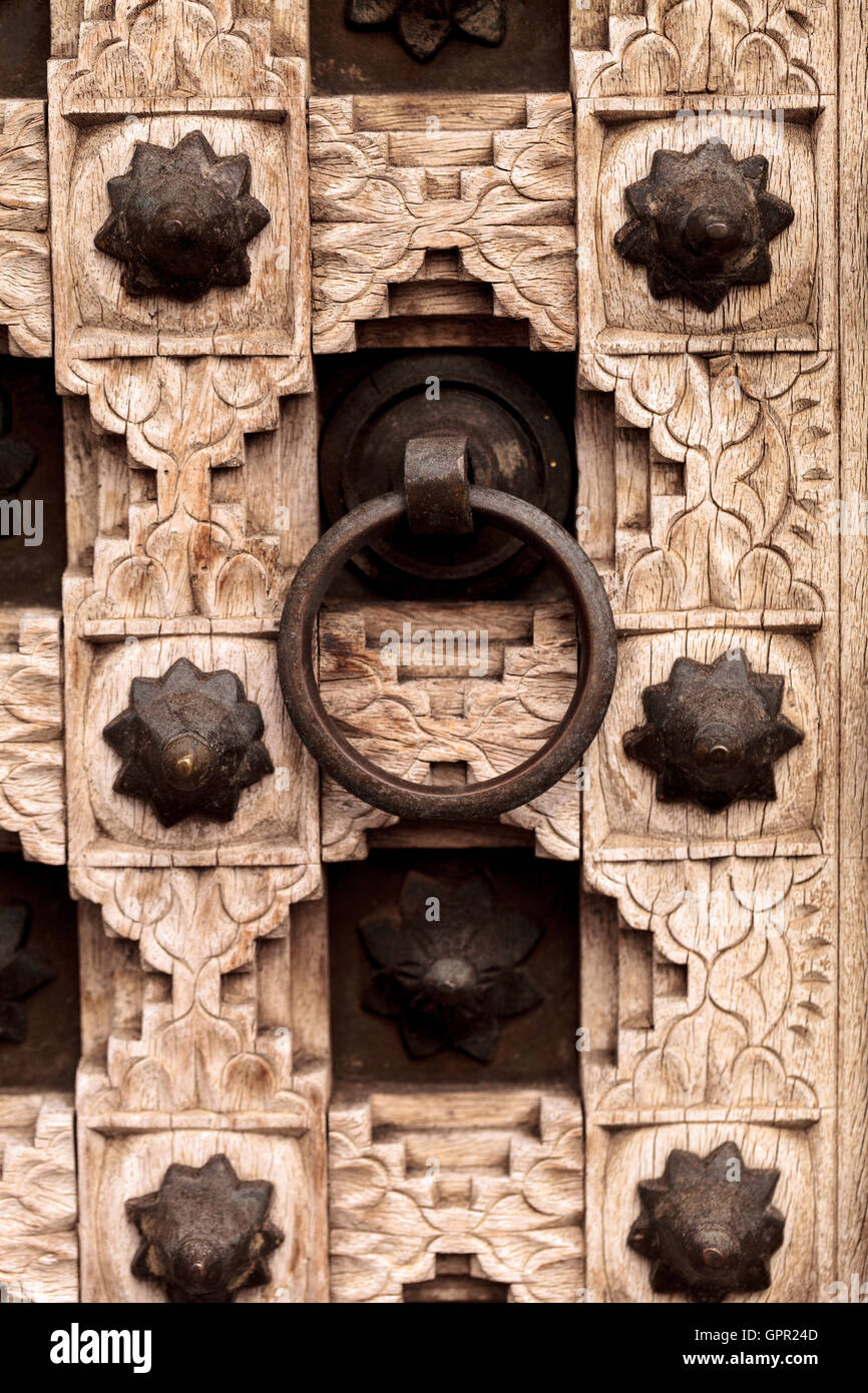 Moroccan antique wood texture door background with iron rings and bolts