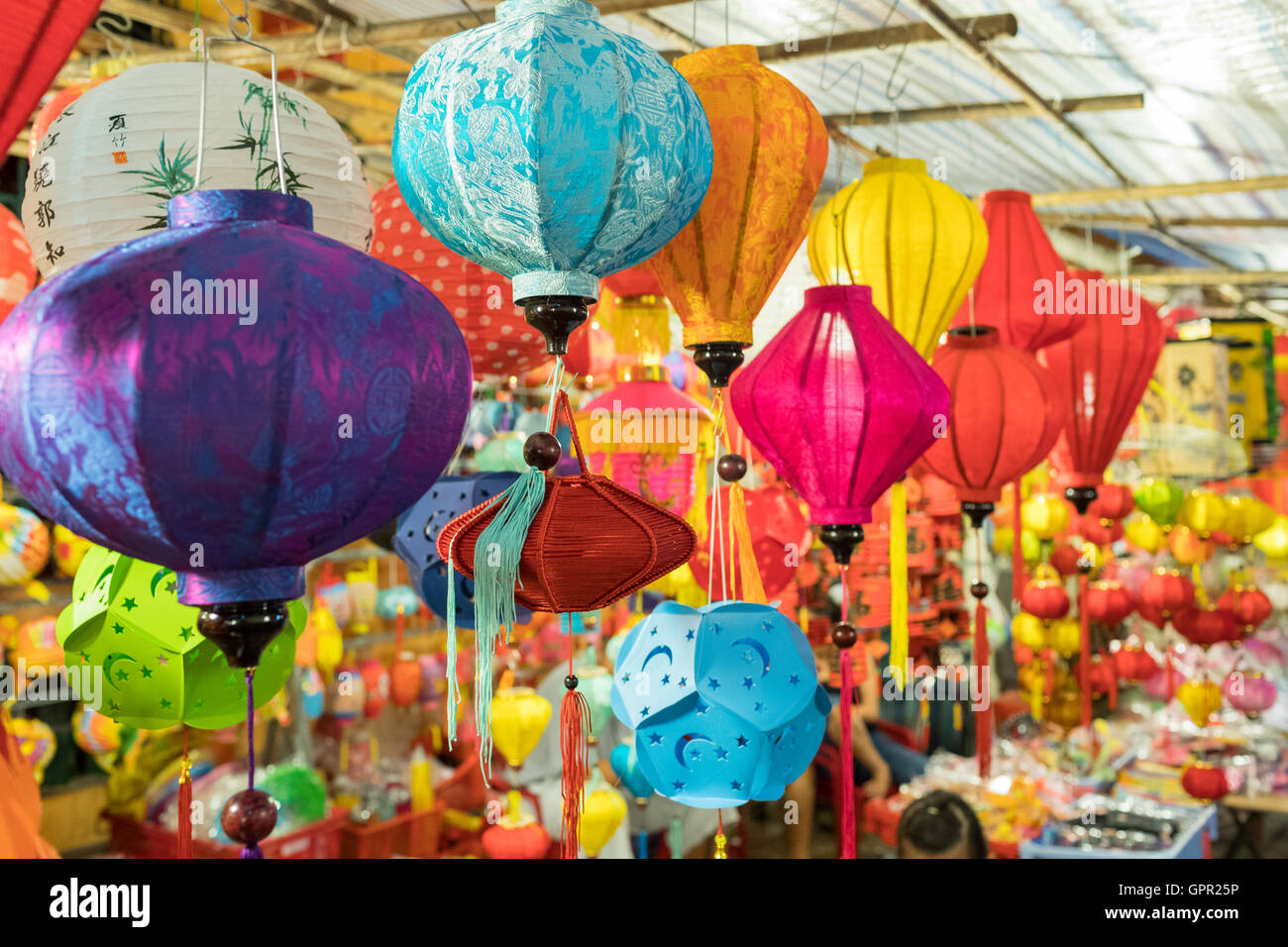 Lanterns hanging on a stand in the streets of Cholon in Ho Chi Minh ...